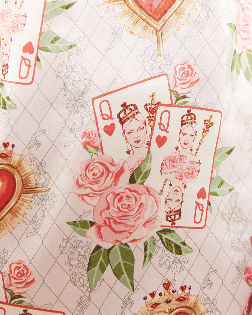 Bella Descanso Queen of Hearts Valentine's Day limited edition print. Featuring pink roses, playing cards and red hearts. The perfect Valentine's Day gift for her. A beautiful stin slip dress adaptable from sleep to street style. Comfortable for lounging and can also be dressed up as a satin cocktail dress, or party dress. 